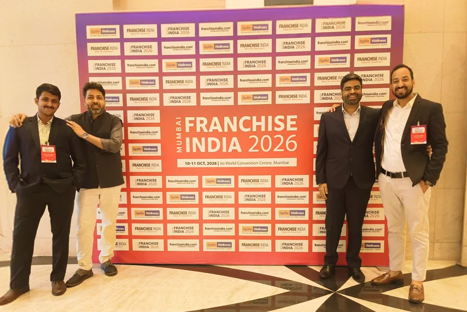 GETPOS team at the Franchise India 2026 Mumbai backdrop